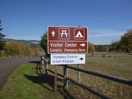 Directional sign at site entrance – visitor center to the right – straight to campground and day use areas